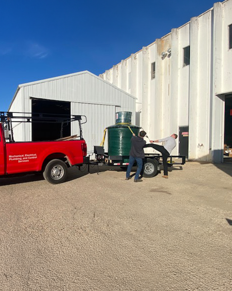 Lift tank for a pool house loading up the truck 1