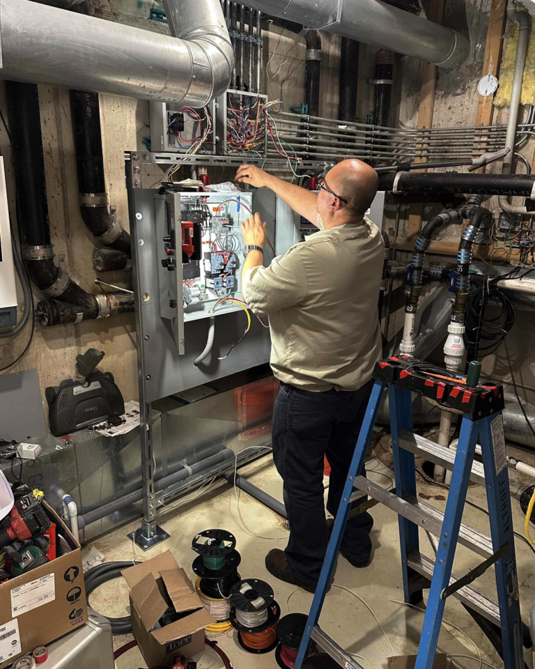 Teo working on an electrical box