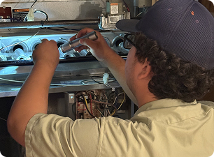 technician working on a furnace